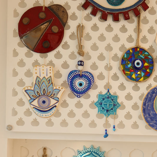 Collection of decorative wall art pieces on a beige background