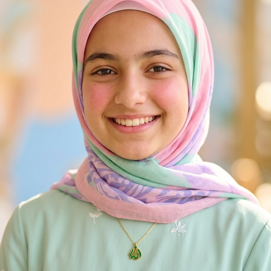Woman wearing a pastel hijab with a blurred outdoor background