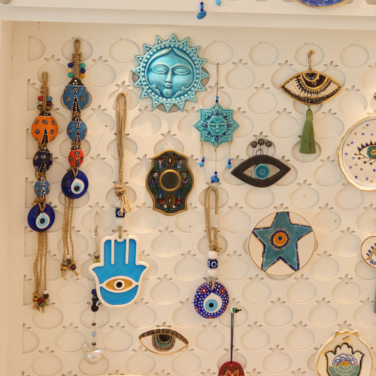 Collection of decorative wall art pieces on a beige background
