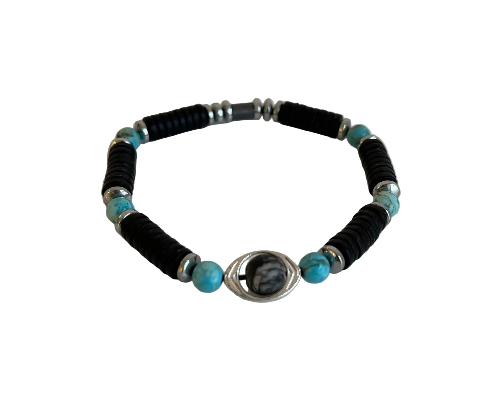 A beaded bracelet featuring black textured cylindrical beads, turquoise blue round beads, silver spacer beads, and a central silver wire-wrapped oval charm with a black and white marbled pattern, displayed on a light off-white background.